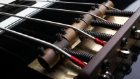 Black bass guitar bridge.jpg