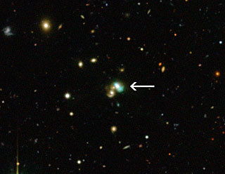A view of newly-discovered Green Bean galaxy J2240. J2240 lies in the constellation of Aquarius (The Water Bearer) and is about 3.7 billion light years from Earth. Image Credit: CFHT/ESO/M. Schirmer A view of newly-discovered Green Bean galaxy J2240. J2240 lies in the constellation of Aquarius (The Water Bearer) and is about 3.7 billion light years from Earth. Image Credit: CFHT/ESO/M. Schirmer