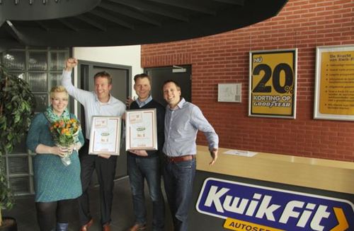 97113-het_team_van_kwik-fit_viert_de_overwinning-large-1364290034