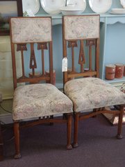 pair of arts and crafts influenced chairs