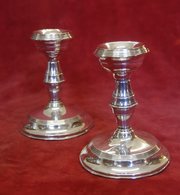 pair of silver candlesticks by broadway and co