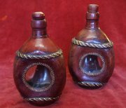 pair of leather covered glass decanters