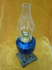 victorian oil lamp with blue glass.