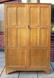 antique furniture a cotswold style oak wardrobe A Cotswold style oak wardrobe