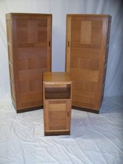 A pair of golden oak single wa
