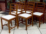 a 1930s Heals walnut dining su