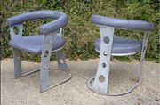 Pair of upholstered steel armc