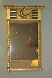 A CARVED GILTWOOD MIRROR