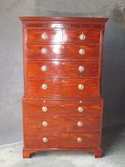 A GEORGIAN MAHOGANY CHEST ON C