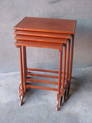 A NEST OF MAHOGANY TABLES