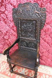 CARVED OAK WAINSCOTT ARM CHAIR