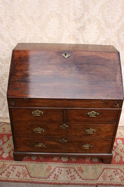 Georgian small walnut stepped, drop well bureaux.
