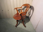 A Swiveling Elm and Mahogany o