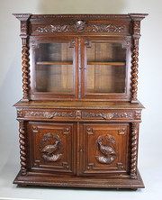 Carved oak glazed bookcase