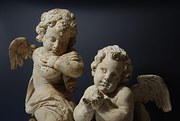 Pair of limewood winged cherub