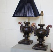 Pair of polished wood urns con