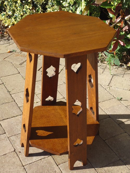 Arts & Crafts Octagonal oak table with pierced leg
