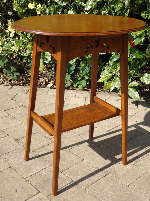 Arts & Crafts Oval oak table with pierced apron