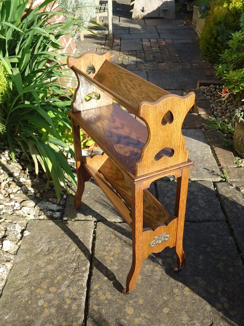 Arts & Crafts book rack with pireced hearts