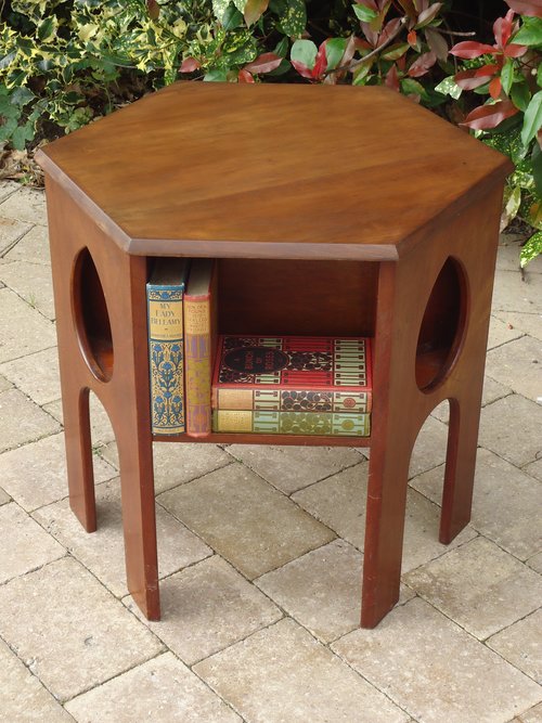 Arts & Crafts book table with cut out teardrops
