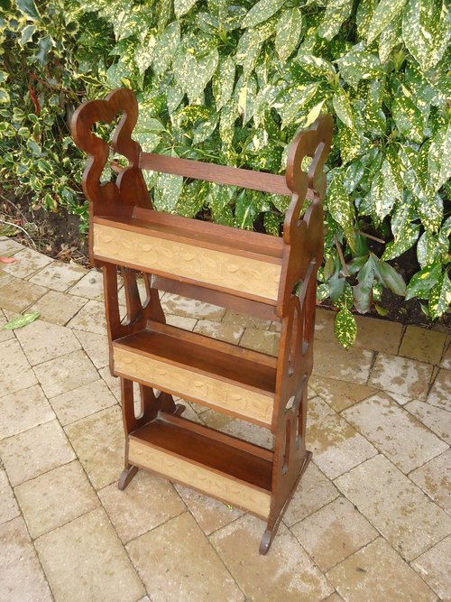 Arts & Crafts bookcase with embroidery panels
