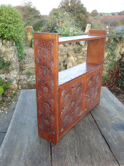 Arts & Crafts carved oak hanging cabinet