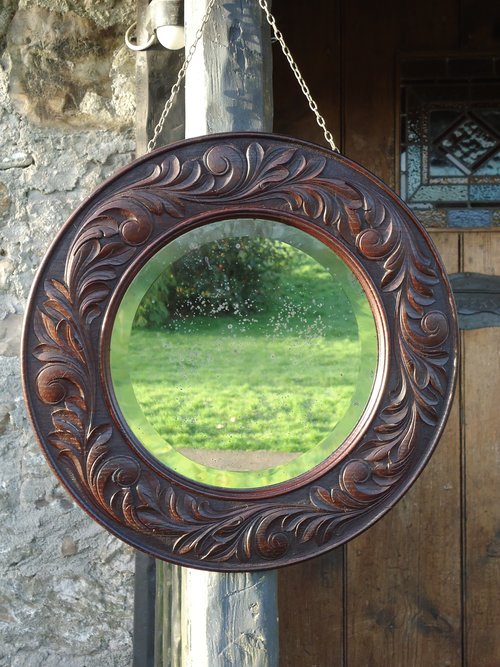 Arts & Crafts carved oak mirror. Keswick
