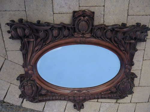 Arts & Crafts carved oak mirror with tulips