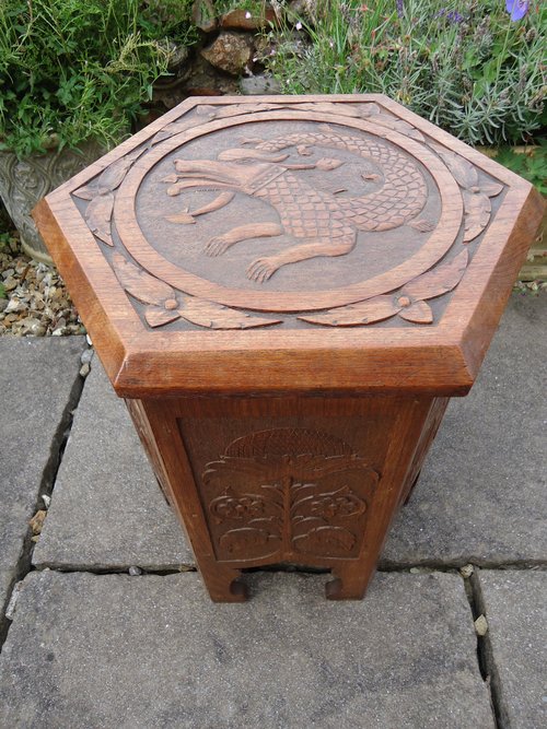 Arts & Crafts carved oak table with storage