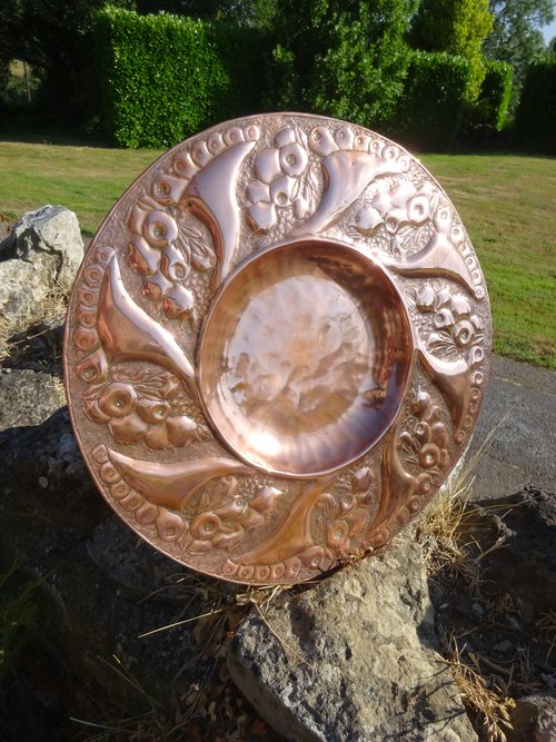 Arts & Crafts copper charger in the Newlyn style