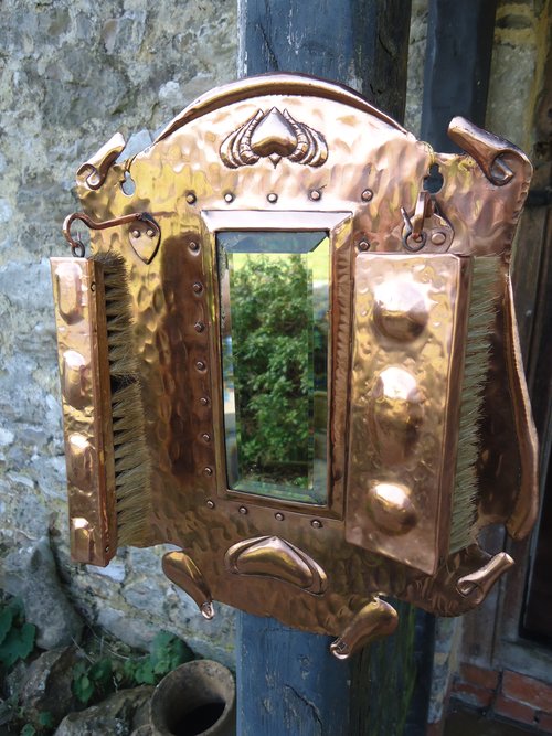 Arts & Crafts copper hall mirror with brushes
