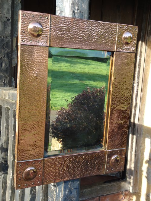 Arts & Crafts copper mirror with raised cabochons
