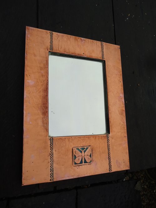 Arts & Crafts copper mirror with butterfly