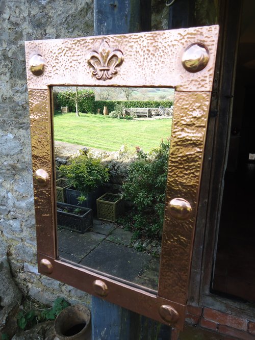 Arts & Crafts copper mirror with Fleur-de-lys