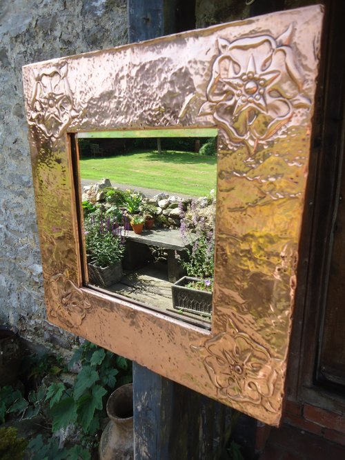 Arts & Crafts copper mirror with Tudor roses
