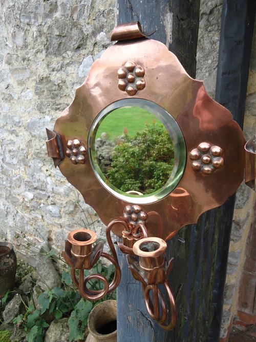 Arts & Crafts copper sconce with mirror
