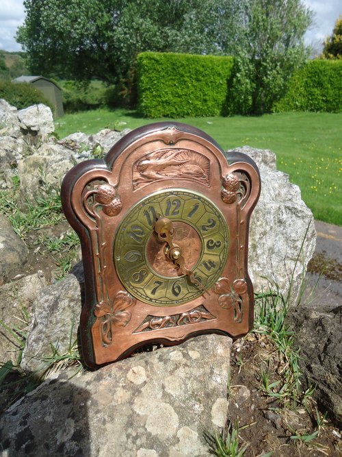 Arts & Crafts copper wall clock with brass face