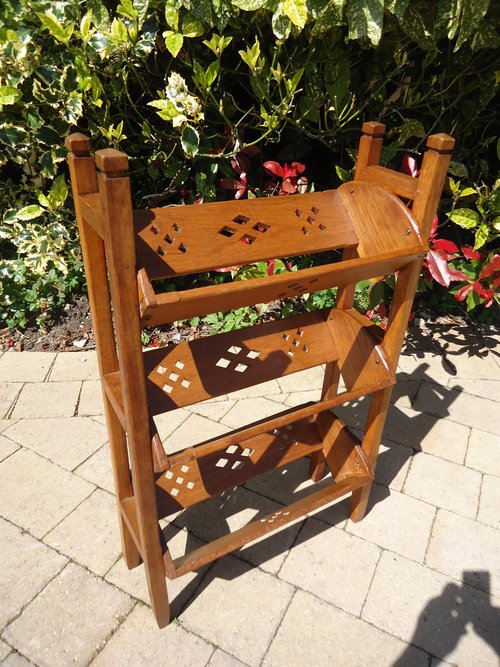 Arts & Crafts oak book stand with piercings