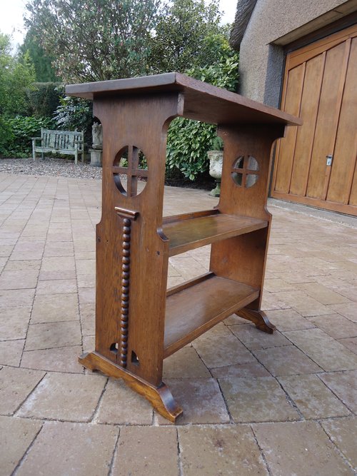 Arts & Crafts oak bookstand with piercings