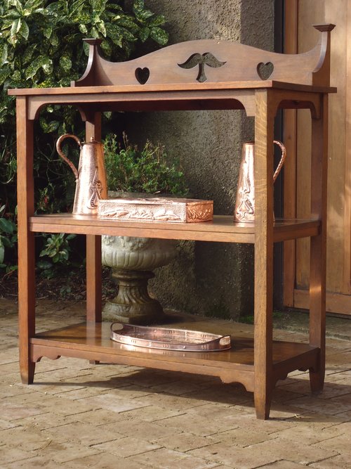 Arts & Crafts oak buffet with pierced hearts