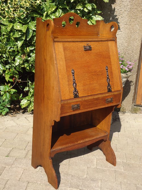 Arts & Crafts oak bureau with pierced hearts