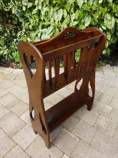 Arts & Crafts oak magazine rack with book trough