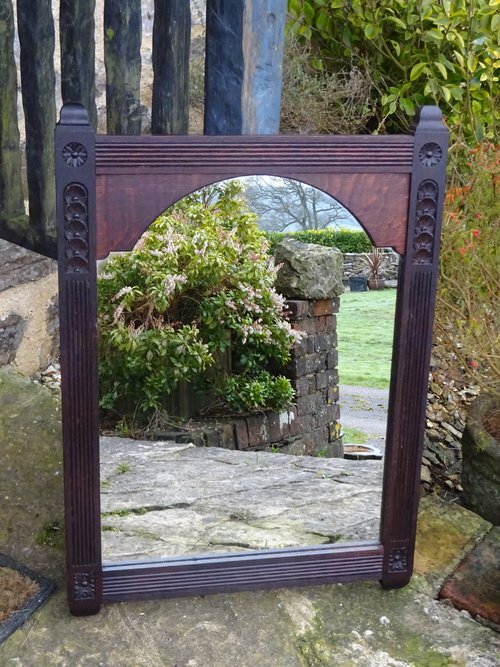 Arts & Crafts carved oak mirror with flowers