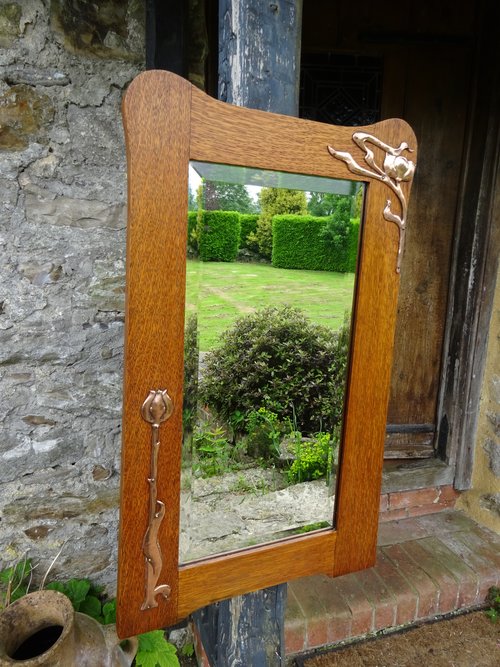 Arts & Crafts oak mirror with copper overlay