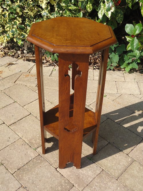 Arts & Crafts oak plant stand with pierced legs