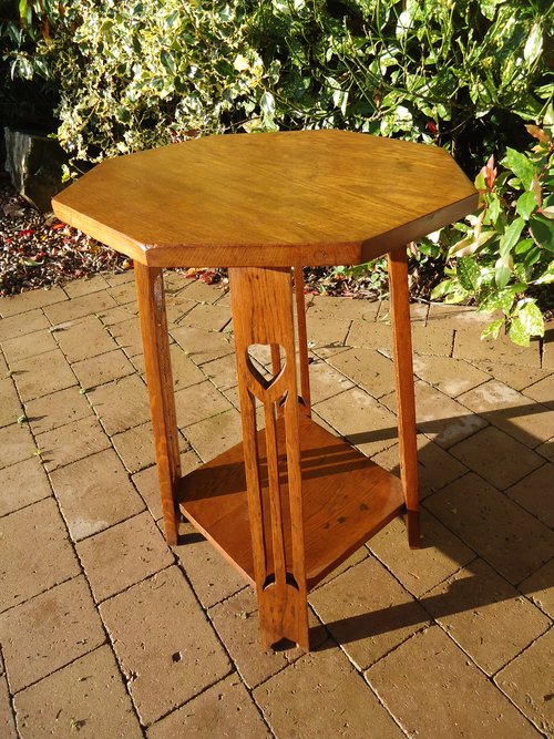 Arts & Crafts oak table with pierced hearts to leg