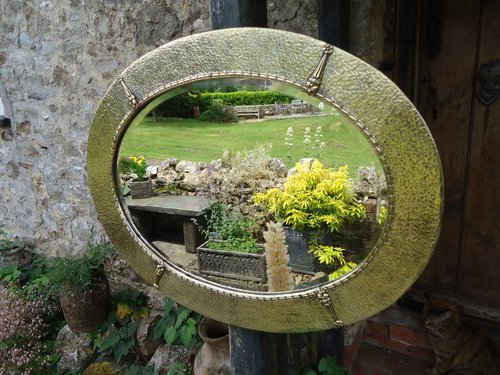 Arts & Crafts oval brass mirror