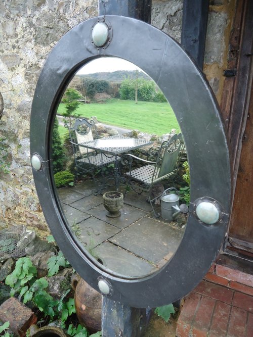 Arts & Crafts pewter mirror with cabochons