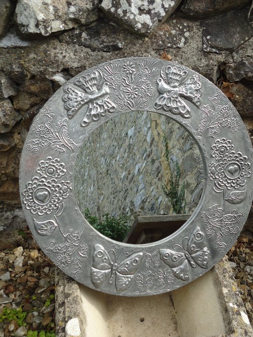 Arts & Crafts pewter mirror with butterflies