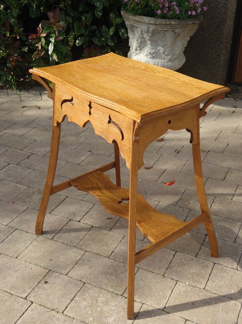 Arts & Crafts two tiered table with piercings